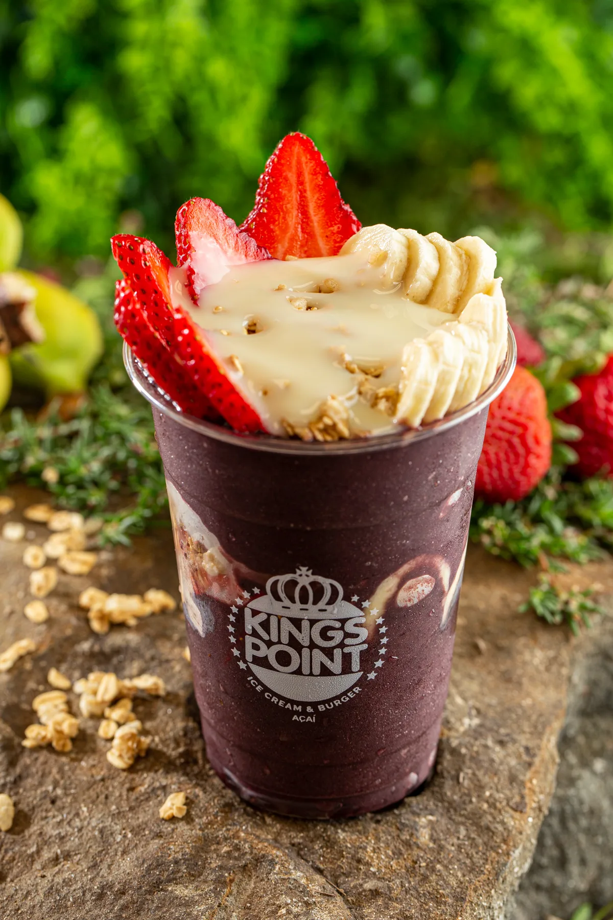Close-up of a creamy açaí cup with fruit and granola